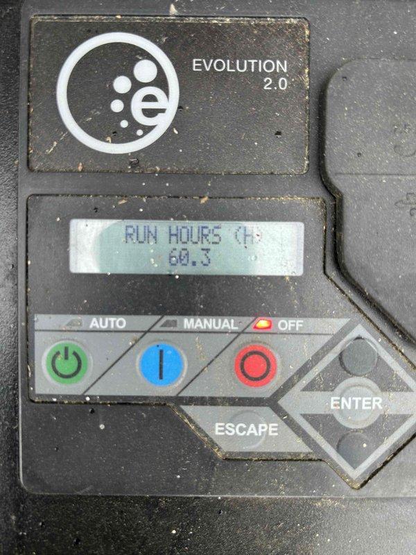 Performed routine preventive maintenance on residential Generac Evolution 2.0 generator unit. Inspected control panel operation, verified low run hours of 0.3 hours on digital display, and confirmed proper functionality of AUTO/MANUAL/OFF control buttons. Conducted visual inspection of exterior generator housing, electrical connections, conduit runs to utility meter, and mounting pad condition. Unit found in good operating condition with all systems functioning as designed.