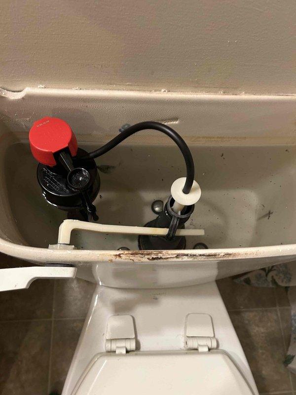 Responded to a toilet malfunction caused by a broken float rod. Upon inspection, found the float rod had failed, preventing proper tank refilling and flush cycle operation. Removed the damaged float rod assembly and replaced it with a new unit. Tested the fill valve operation and adjusted water level to manufacturer specifications. Verified proper flapper seal and flush mechanism function. Cleaned mineral deposits from tank components to ensure optimal performance. Completed final testing to confirm proper fill, flush, and shutoff cycles.