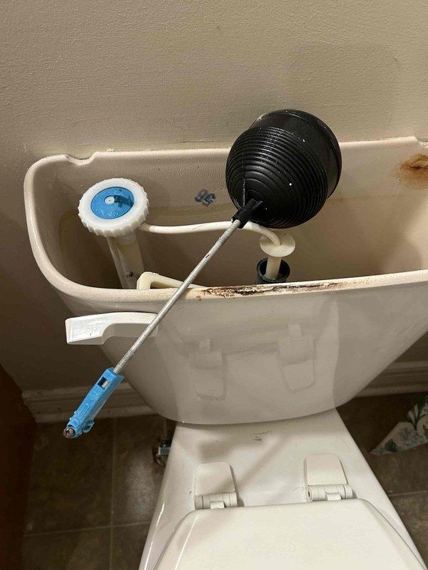 Responded to a toilet malfunction caused by a broken float rod. Upon inspection, found the float rod had failed, preventing proper tank refilling and flush cycle operation. Removed the damaged float rod assembly and replaced it with a new unit. Tested the fill valve operation and adjusted water level to manufacturer specifications. Verified proper flapper seal and flush mechanism function. Cleaned mineral deposits from tank components to ensure optimal performance. Completed final testing to confirm proper fill, flush, and shutoff cycles.