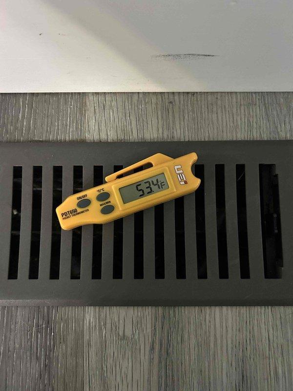Completed comprehensive maintenance tune-up on heat pump package unit with propane backup located on exterior side of residence. Performed electrical diagnostics on internal components using digital multimeter, inspected heavily oxidized copper refrigerant lines showing age-related patina, and verified system operation with supply air temperature measuring 53°F at interior floor register. All components tested within acceptable parameters for continued operation under club maintenance agreement.