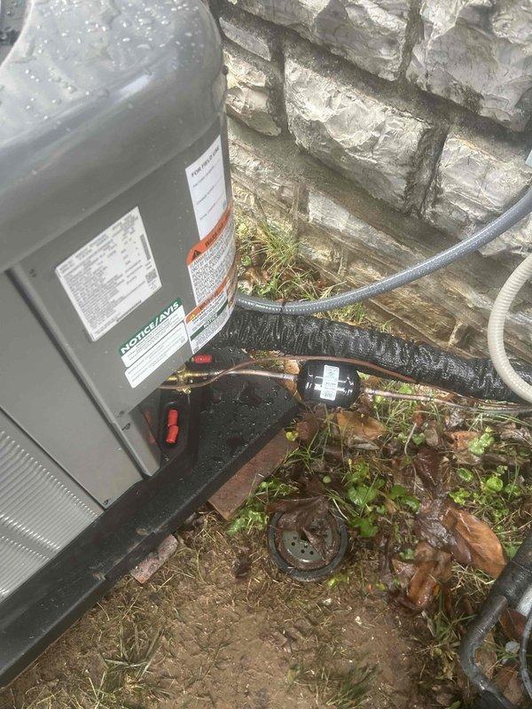 Completed full residential HVAC system replacement with RUUD 2-ton two-stage heat pump (RP14AY24AJ2NA), 2-ton air handler (RH2TY2417STANNJ), and 10kW heat kit (RXBH-1724A10J-B). Installation included outdoor unit pad with snow legs, electrical disconnect box, electrical whip kit, insulated refrigerant lines with filter, digital thermostat, and standard air filter rack. Installed auxiliary drain pan in attic with water sensor, SS2 coil drain safety sensor, trap, and overflow drain pan with water sensor for ceiling protection. Created transition to existing ductwork and verified proper leveling of equipment. Removed and disposed of existing equipment, obtained applicable permits, and completed all work to code compliance standards. System startup performed with refrigerant charge verified and all safety controls tested for proper operation.