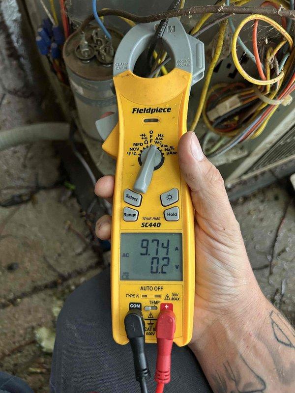 Completed Gold Level prepaid maintenance on single-system air conditioning unit located in basement. Performed comprehensive tune-up including system diagnostics, temperature measurements at supply register showing 73°F, and electrical testing with clamp meter revealing 9.74 amp draw on compressor circuit. Inspected capacitor connections and verified proper voltage at 0.2V differential. All electrical components operating within manufacturer specifications. Customer providing their own 20X25X3 filter for system. System operating efficiently with no issues identified during inspection.