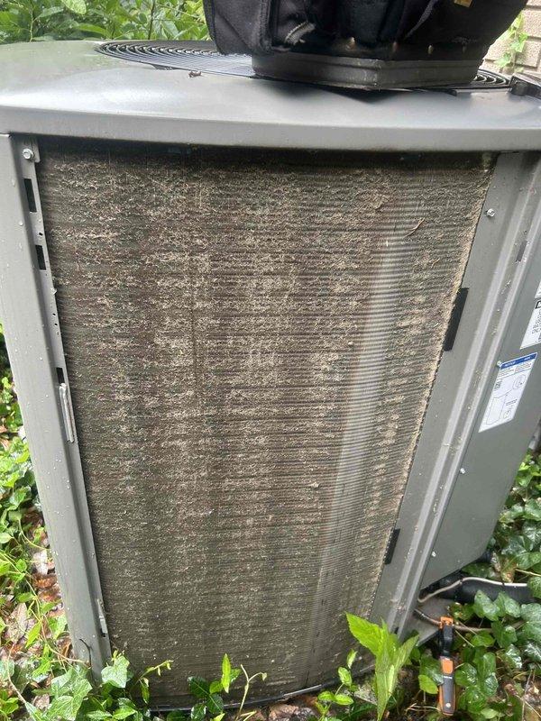 Completed Club Single maintenance on 3-year-old HVAC system with indoor unit in basement and outdoor condensing unit. Outdoor unit coils were heavily contaminated with dirt, dust, and debris accumulation, requiring thorough cleaning to restore proper heat exchange efficiency. Air filter showed extensive buildup of particulate matter and was serviced as part of maintenance protocol. System includes AprilAire 800 humidifier. All maintenance tasks completed per club membership agreement specifications.