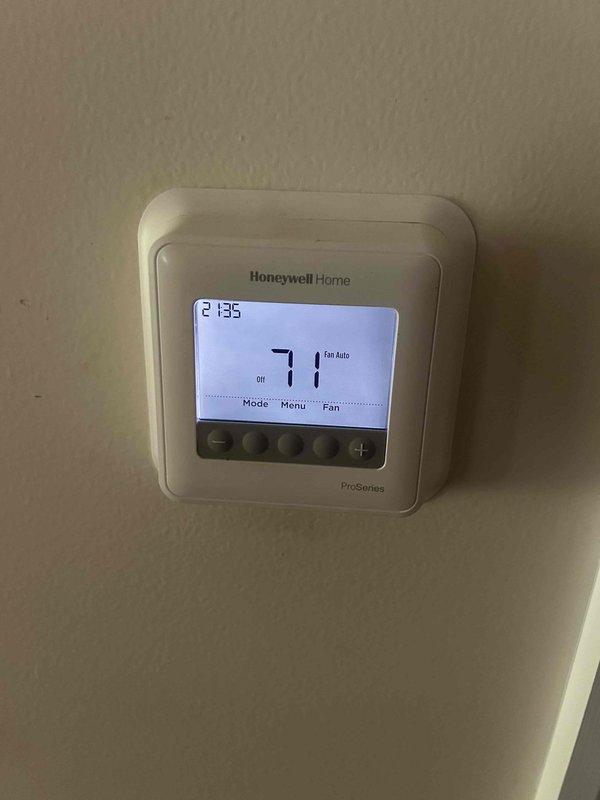 Completed routine preventive maintenance tune-up on heat pump and air handler system per care plan agreement. Performed comprehensive system diagnostics including electrical measurements in attic-mounted equipment, verified thermostat operation and programming on Honeywell Home ProSeries unit displaying proper temperature control at 71 degrees. Customer provided their own 16x25x4 filter for replacement during service visit.
