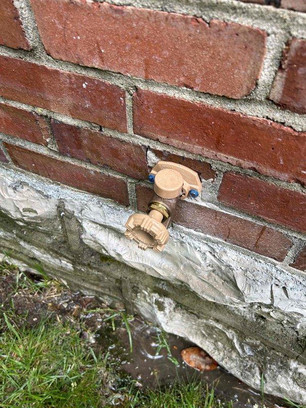 Responded to non-functional outdoor spigot at 70-year-old residence where fixture had been inoperative for several months. Upon inspection, identified failed hose bib mounted on exterior brick wall above concrete foundation. Accessed supply line from crawl space, locating copper piping and PVC connections behind wall assembly. Removed deteriorated outdoor spigot and assessed mounting location showing signs of age-related wear and moisture exposure at foundation level. Installed new frost-free self-draining hose bib as requested to prevent future freeze damage, ensuring proper pitch for automatic drainage when shut off. Secured fixture to brick wall with appropriate masonry anchors and verified supply line connections in crawl space remained secure. Tested new spigot for proper operation, confirming water flow and automatic drain-back function when valve closed. Documented installation with photographs showing completed exterior fixture and associated crawlspace plumbing connections.