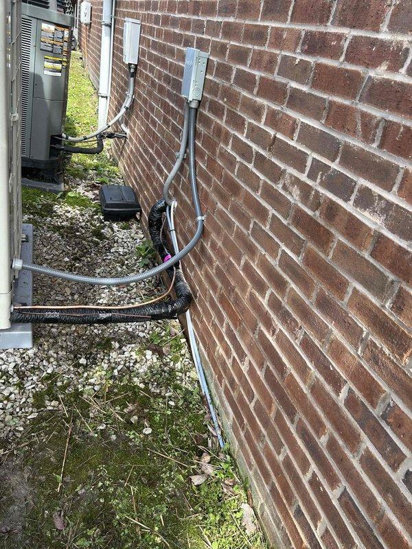 Completed full manufacturer warranty replacement of Daikin HVAC system including side discharge heat pump (Model DH9VSA4810), air handler (Model DFVE60DP1300), heat kit (Model HKTSD20DB), and Daikin One thermostat controller (Model DTST-TOU-A). Removed existing failed equipment and returned to shop per warranty protocol. Flushed refrigerant lines with dry nitrogen to ensure system cleanliness and prevent contamination. Installed new equipment in side yard location on existing concrete pad against brick exterior wall. Connected all electrical conduits and refrigerant lines, verified proper mounting and secure fittings. Performed complete system startup procedures including refrigerant charge verification, airflow measurements, and electrical connections testing. Confirmed all operating parameters within manufacturer specifications for optimal performance and warranty compliance.