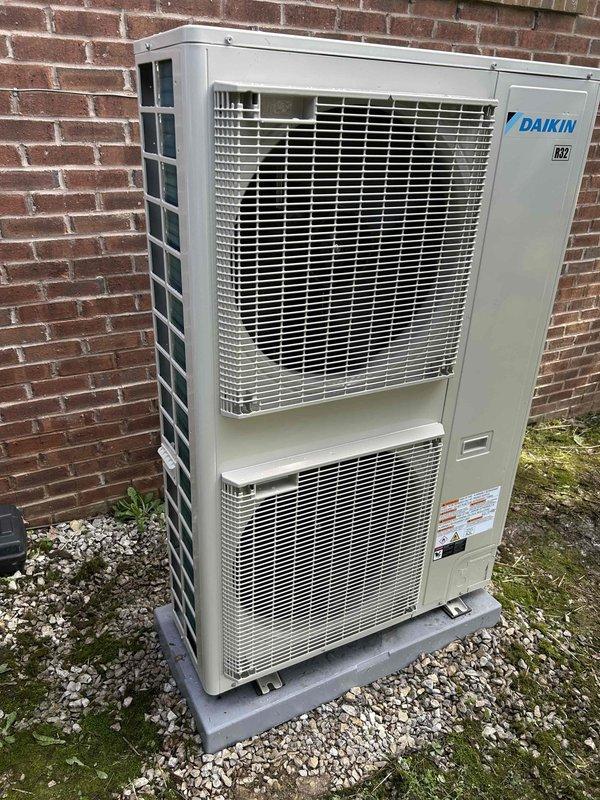 Completed full manufacturer warranty replacement of Daikin HVAC system including side discharge heat pump (Model DH9VSA4810), air handler (Model DFVE60DP1300), heat kit (Model HKTSD20DB), and Daikin One thermostat controller (Model DTST-TOU-A). Removed existing failed equipment and returned to shop per warranty protocol. Flushed refrigerant lines with dry nitrogen to ensure system cleanliness and prevent contamination. Installed new equipment in side yard location on existing concrete pad against brick exterior wall. Connected all electrical conduits and refrigerant lines, verified proper mounting and secure fittings. Performed complete system startup procedures including refrigerant charge verification, airflow measurements, and electrical connections testing. Confirmed all operating parameters within manufacturer specifications for optimal performance and warranty compliance.
