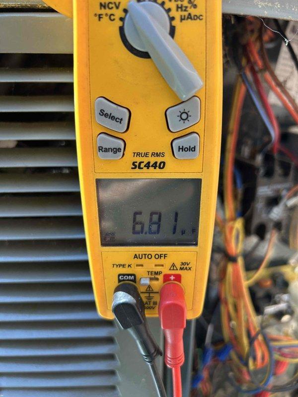 Completed comprehensive care plan tune-up on heat pump system. Performed electrical diagnostics using clamp meter, measuring amperage draw at 0.98A and voltage at 0.1V to verify proper system operation and component performance. Inspected condenser coil fins, control wiring connections, and all electrical components to ensure optimal heat pump functionality and efficiency.