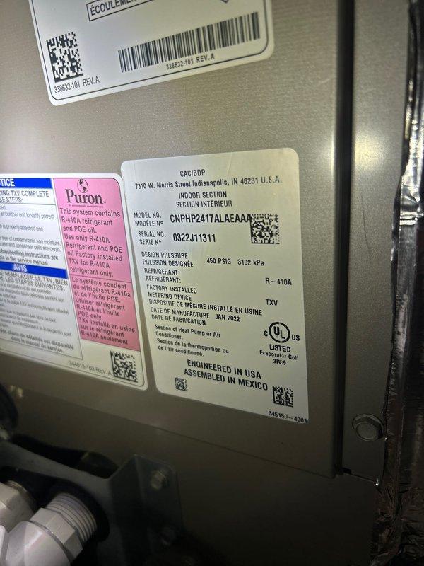 Completed Club Duo maintenance service on two air conditioning systems and two gas furnace units. Customer provided their own filters for installation. Documented equipment nameplate information including Puron R-410A system specifications and recorded serial numbers for service records. Observed significant dust and debris accumulation on evaporator coil during inspection, photographed condition for documentation purposes.