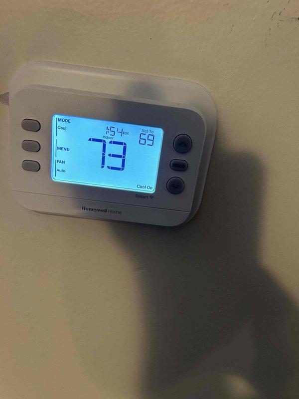 Completed annual care plan tune-up on heat pump and air handler system located in hallway closet. Performed comprehensive system inspection and temperature diagnostics, verified thermostat operation showing cooling mode at 73°F setpoint with system actively running, and measured supply air temperature at 59.5°F at ductwork. System operating within normal parameters with proper temperature differential across coil.
