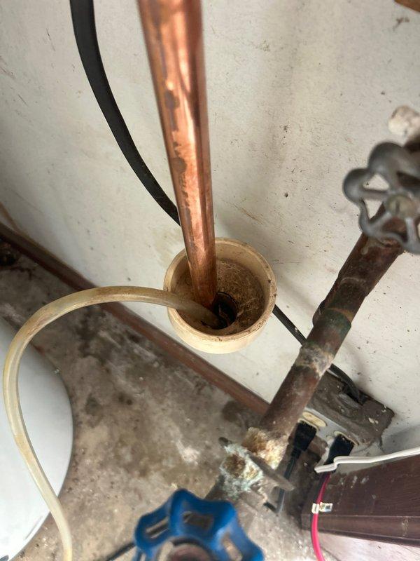 Completed installation of a 50-gallon water heater with new copper supply line connections and shutoff valves. All plumbing connections were properly fitted and secured, including T-fittings and brass components, with appropriate insulation applied to hot water lines to ensure efficient operation and code compliance.