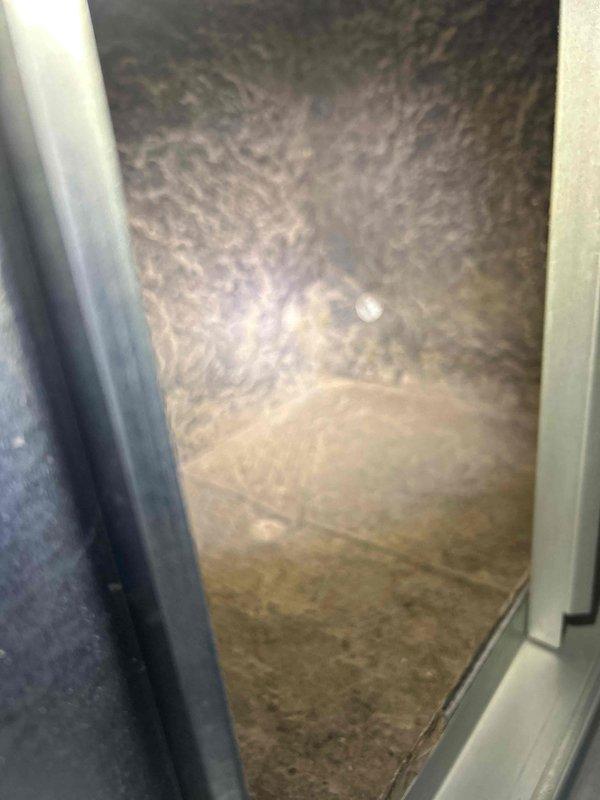 Responded to no cooling complaint on 7-year-old gas furnace/AC system with reported whistling noise. Upon inspection, found dirty air filter restricting airflow, which was contributing to reduced cooling performance and abnormal system sounds. Inspected indoor unit and attic installation, verifying spray foam insulation integrity around unit compartment. Documented filter condition showing significant dust accumulation despite reported filter change in March. System airflow restored after filter inspection; recommended immediate filter replacement to restore proper cooling capacity and eliminate noise issue.