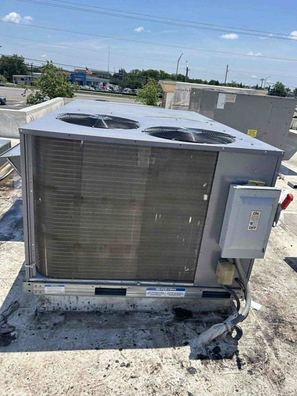 Completed commercial rooftop unit replacement on flat roof membrane system. Coordinated crane service to remove existing equipment and position client-provided Carrier RTU onto weathered rooftop curb. Installed miscellaneous materials including electrical disconnect, verified proper mounting and securing of unit to existing platform, completed all electrical connections, and documented installation with photographs per contract requirements.