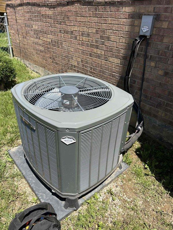 Completed preventive maintenance tune-up on heat pump and air handler system located in garage. Performed comprehensive inspection including temperature and humidity readings (43% RH recorded), verified proper airflow across evaporator coil and ductwork, and inspected outdoor condenser unit with operational fan assembly and electrical disconnect. All components found operating within normal parameters with customer providing their own filter replacements as requested.