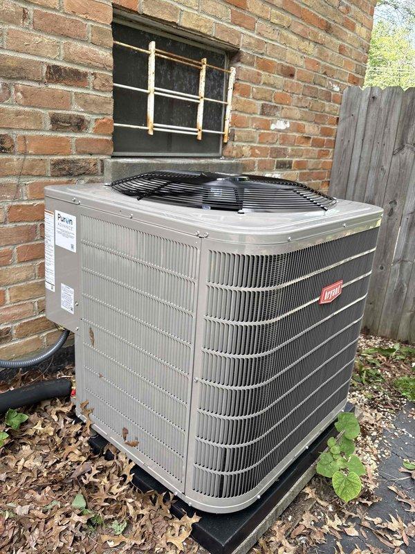 Completed residential HVAC system installation including Bryant 148TAN04800W two-stage 4-ton condenser rated up to 18 SEER2, Bryant CVAVA4821XMA 4-ton evaporator coil, and Honeywell digital WiFi thermostat. Installed outdoor unit on protective pad against exterior brick wall with electrical whip kit, disconnect box, and proper refrigerant line insulation with filter drier. Replaced 14x14 flat return grille in return drop and completed transition from evaporator coil to existing ductwork. Installed SS2 coil drain safety water sensor for secondary drain pan protection. Secured all refrigerant lines and condensate drainage piping to building exterior with appropriate mounting brackets. Removed and disposed of existing equipment, obtained applicable permits, and verified system operation with successful startup and testing procedures.