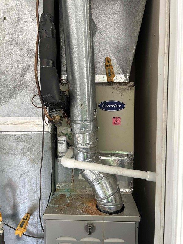 Responded to no cooling complaint on 4-year-old Carrier downstairs system. Performed diagnostic evaluation of indoor air handler and measured supply air temperature at 55.5°F. System had been providing adequate heating but failed to reach cooling setpoint. Inspected ductwork connections, refrigerant lines, and electrical components for proper operation and identified cooling system malfunction requiring correction.