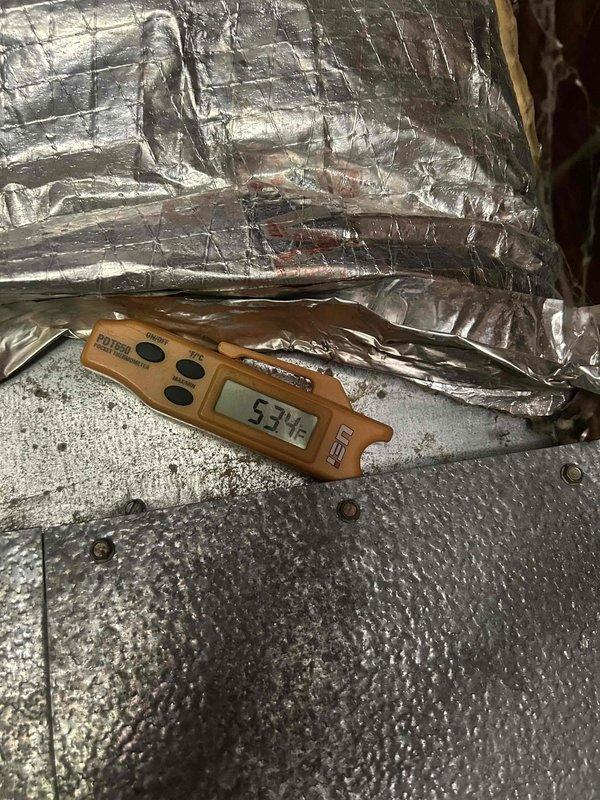 Responded to no cooling complaint on electric air conditioning system with reported freezing issue. Upon arrival, unit had been thawed and was operational. Performed diagnostic evaluation to determine root cause of freeze-up condition. Measured supply air temperature at 53.5°F at the ductwork, confirming system was cooling at time of inspection. Connected refrigerant manifold gauges to outdoor condensing unit to check system pressures and verify proper refrigerant charge. Conducted visual inspection of indoor and outdoor components. Based on diagnostics performed, system was operating within normal parameters at time of service, though previous freeze-up condition had occurred. Recommended monitoring system performance and checking air filter regularly to prevent restricted airflow, which is a common cause of evaporator coil freezing.