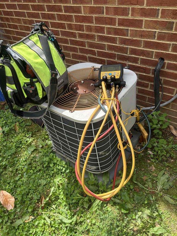 Responded to no cooling complaint on electric air conditioning system with reported freezing issue. Upon arrival, unit had been thawed and was operational. Performed diagnostic evaluation to determine root cause of freeze-up condition. Measured supply air temperature at 53.5°F at the ductwork, confirming system was cooling at time of inspection. Connected refrigerant manifold gauges to outdoor condensing unit to check system pressures and verify proper refrigerant charge. Conducted visual inspection of indoor and outdoor components. Based on diagnostics performed, system was operating within normal parameters at time of service, though previous freeze-up condition had occurred. Recommended monitoring system performance and checking air filter regularly to prevent restricted airflow, which is a common cause of evaporator coil freezing.