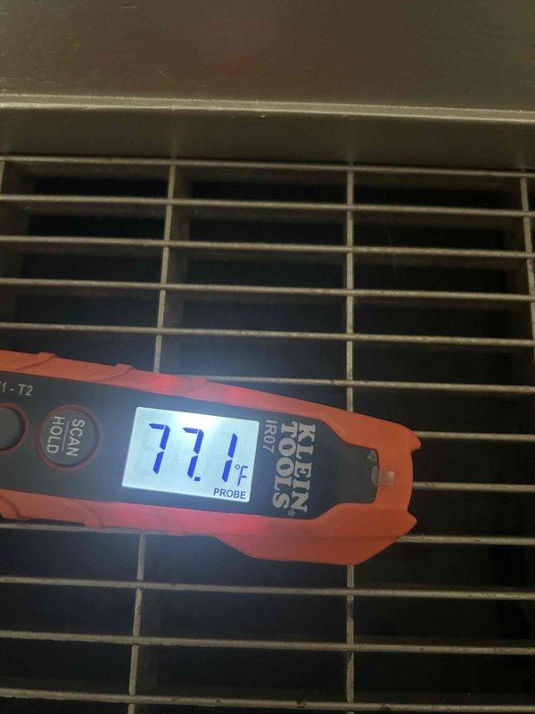 Responded to no cooling complaint on residential air conditioning system. Upon arrival, performed temperature diagnostics at supply register measuring 77.1°F and return air at 56.4°F, indicating inadequate temperature split and confirming insufficient cooling capacity. System requires further diagnostic evaluation to determine root cause of cooling deficiency, which may include refrigerant charge verification, airflow assessment, and component functionality testing.