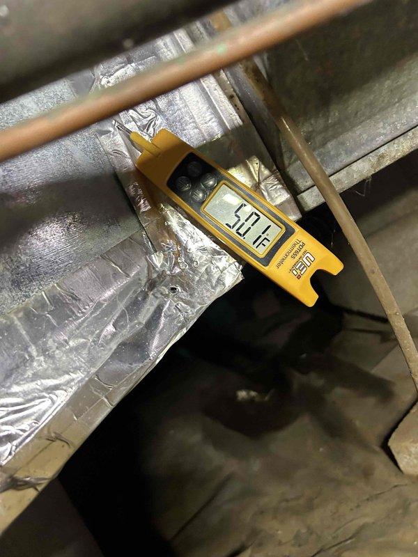 Responded to no cooling call on 5-year-old air conditioning system. Upon arrival, unit had restored operation, possibly due to tripped breaker that was reset. Performed comprehensive system inspection to verify proper operation and identify any underlying issues. Measured supply air temperature differential at ductwork, recording 10.2°F reading. Inspected indoor air handler unit in crawlspace, noting normal dust accumulation consistent with system age. Verified electrical connections, refrigerant operation, and airflow. System operating within normal parameters at time of departure with no additional deficiencies found.