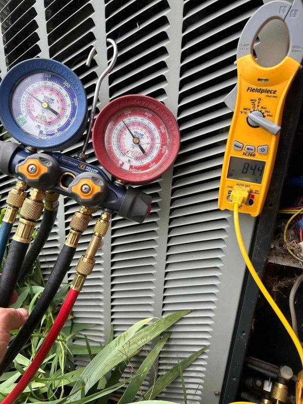 Responded to no cooling complaint on 3-year-old electric air conditioning system. Upon arrival, found system frozen with no airflow through the indoor unit. Performed diagnostic evaluation using manifold gauges and clamp meter to assess refrigerant pressures and electrical draw. Measured system parameters showing 8.4 amp draw on compressor circuit. Identified frozen evaporator coil as primary symptom requiring further investigation into root cause, which typically includes restricted airflow from dirty filter, low refrigerant charge, or blower motor issues. Documented system conditions with diagnostic equipment readings and photographic evidence for service records.