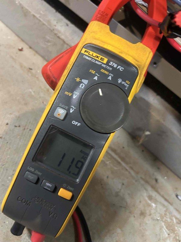 Responded to no cooling condition on 7-year-old HVAC system displaying error codes 2, 5, and 7. Upon arrival, unit had been shut down due to multiple fault codes. Performed diagnostic testing using clamp meter to measure electrical parameters and verify system operation. Documented equipment readings and conditions for service record purposes.
