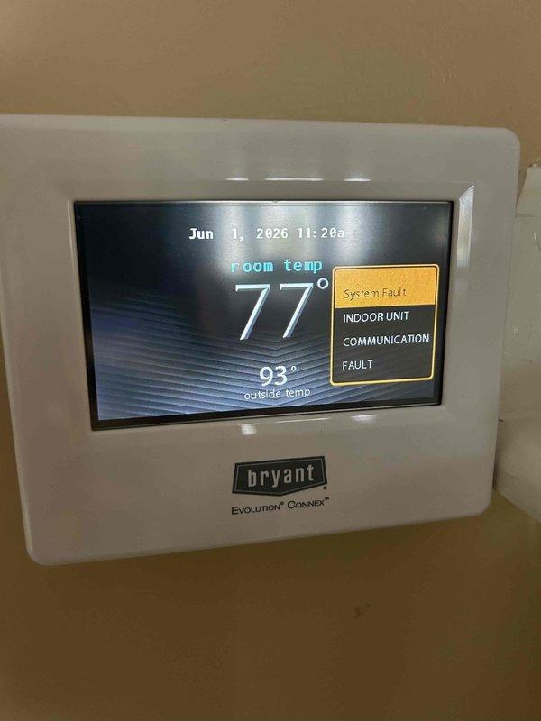 Responded to no cooling call on four-year-old Bryant Evolution Connex system displaying "Indoor Unit Communication Fault" error on thermostat. Upon inspection, diagnosed communication failure between thermostat and air handler preventing system operation. Troubleshot wiring connections, control board signals, and network communication protocol between indoor unit and thermostat to identify root cause of fault condition and restore proper system communication and cooling function.