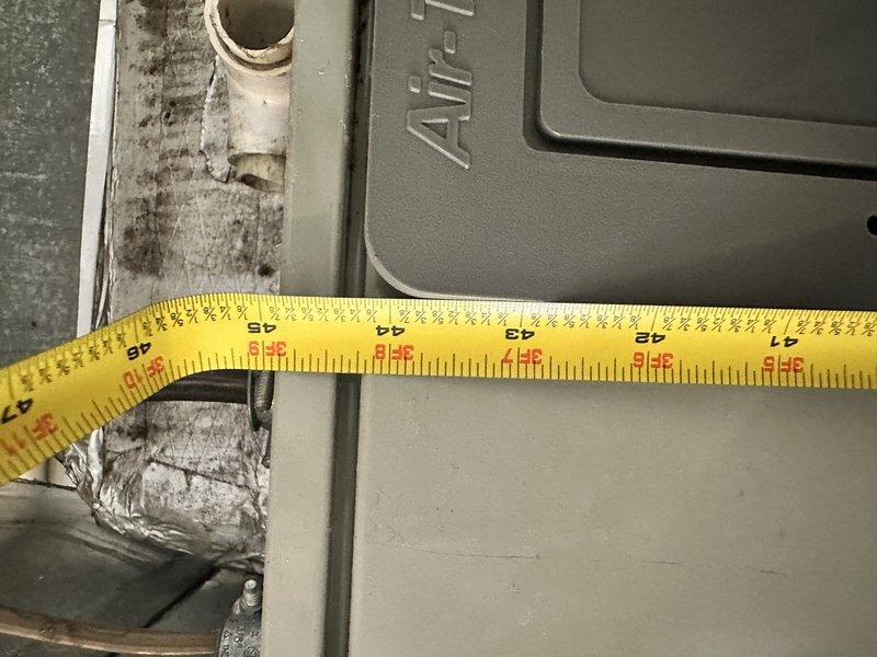 Responded to no-cool complaint on 17-year-old electric HVAC system experiencing frozen coil and restricted airflow for approximately one week. Upon inspection, found air handler unit with severely compromised airflow due to dirty conditions, contaminated electrical compartment with heavy dust and debris accumulation, and deteriorated insulation showing significant wear and staining. System age and overall condition indicated full replacement necessary rather than repair, and provided comprehensive replacement estimate for new equipment installation.