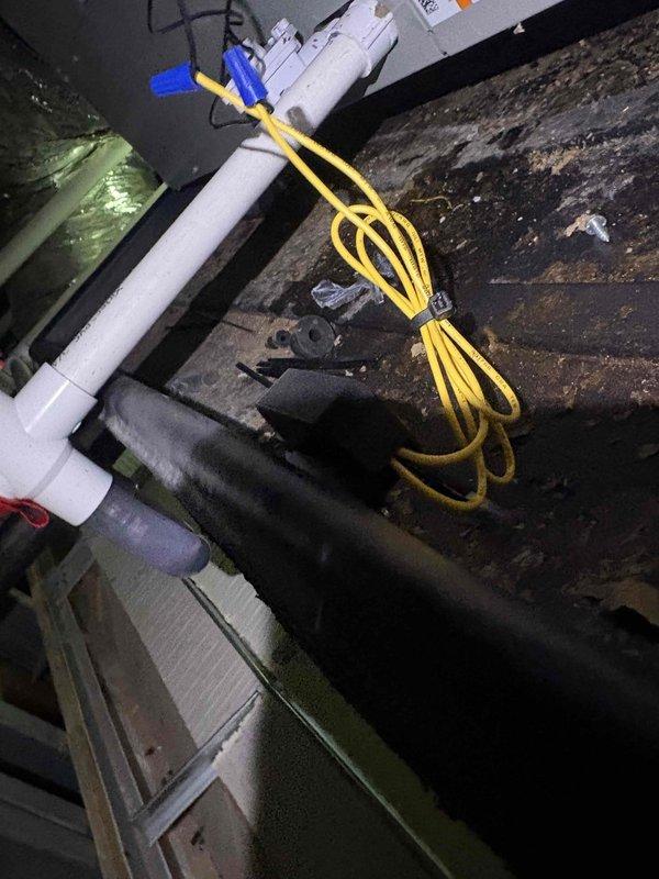 Returned to site to complete warranty work on second air handler system installed in drop ceiling location. Original three-phase heat kit was defective out of the box during initial installation and required factory replacement. Successfully installed new factory-ordered heat kit in air handler unit located in confined drop ceiling space. Verified proper electrical connections and tested system operation. Unit now functioning as designed with heat kit operational. Documentation photos captured of completed installation.