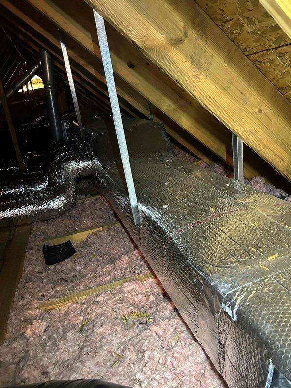 Responded to no cooling complaint on 2019-installed system consisting of Model 24ACC430A003 outdoor unit (Serial: 2919E13556) and Model CNPHP3017ALA air handler (Serial: 2219X46735). Previous contractor suspected ductwork issues. Upon inspection of attic-mounted indoor unit, discovered significant condensation accumulation on flexible ductwork at plenum junction points, indicating inadequate insulation and possible air leakage at duct connections. Observed moisture pooling on multiple supply ducts converging at central distribution point, with visible water droplets and dampness on metallic duct surfaces. Identified improperly supported flex duct runs with insufficient insulation barrier between conditioned air and attic ambient temperature. System equipment confirmed operational but cooling capacity compromised by duct losses and condensation issues causing reduced airflow and efficiency. Documented warranty status showing enhanced parts coverage active through 2029 for original owner