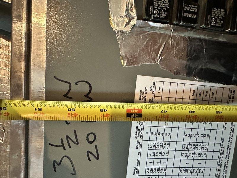 Conducted on-site assessment for heat pump system replacement estimate. Downstairs unit is inoperative and requires full replacement; upstairs unit is also 12 years old and may be replaced simultaneously. Documented electrical panel specifications and exterior condenser unit location, measuring clearances and confirming installation requirements for ASAP replacement timeline.