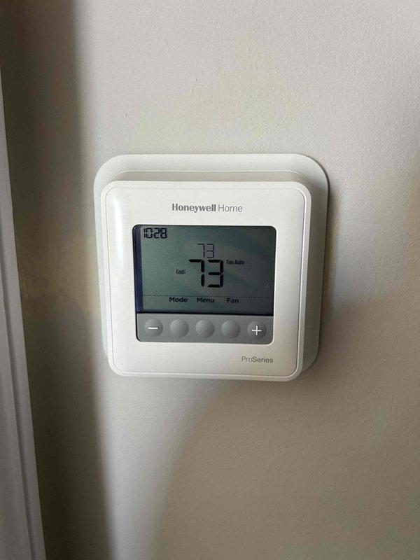 Completed routine AC tune-up on 5-year-old heat pump/air handler system located in attic space. Performed standard maintenance procedures including inspection of refrigerant lines, electrical connections, and ductwork. Replaced 16x20x1 air filter as requested. Verified Honeywell ProSeries thermostat operation and system functionality; all components operating within normal parameters with no issues identified.
