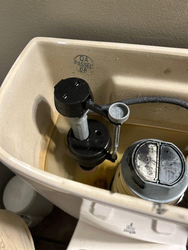 Responded to main bathroom toilet with continuous water flow issue affecting modern dual-flush mechanism. Upon inspection, identified malfunctioning flush valve assembly causing improper seal and constant water running into bowl. Removed tank lid, diagnosed failed flush valve seal component, and replaced defective parts within the flush mechanism. Tested fill valve operation, adjusted water level, and verified proper shutoff function. Cycled flush system multiple times to confirm complete water shutoff and proper tank refill. Unit now operating normally with no further water flow issues detected.