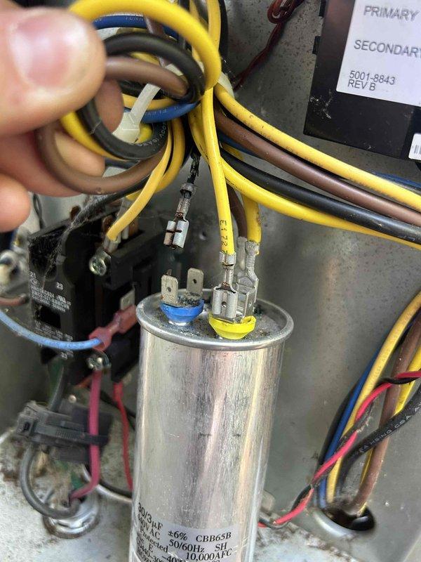 Responded to no cooling complaint on sunroom AC unit not maintaining setpoint temperature. Upon inspection, diagnosed failed dual run capacitor on Goodman model CNPHP2417ALAEAA4 condensing unit. Capacitor tested below specification, preventing compressor and condenser fan motor from operating at full capacity. Replaced defective capacitor with proper OEM replacement, verified electrical connections, and tested system operation with normal amperage draw and temperature differential restored.