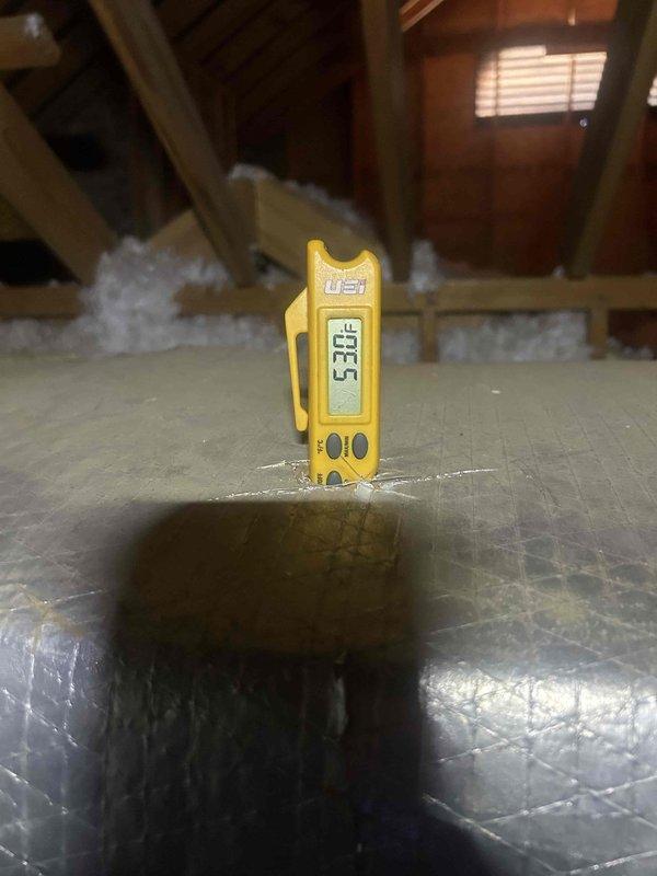 Responded to callback for geothermal unit experiencing recurring compressor monitor errors and overheating issues. Upon arrival, contacted technical support manager as directed and assessed attic-mounted equipment. Recorded temperature readings of 53.5°F and 58.1°F at unit location using digital measurement device. Reset system per manufacturer protocol and instructed household occupants on emergency reset procedure for future lockouts pending scheduled manufacturer site visit.