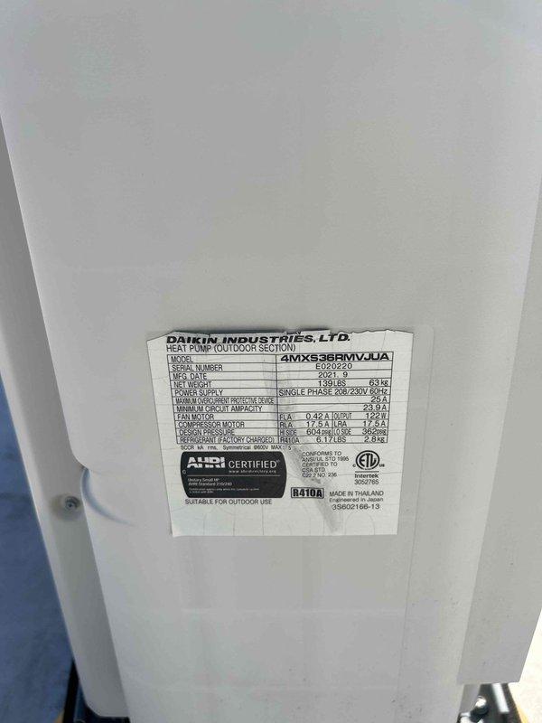 Completed routine maintenance and inspection on Daikin 4MXX36RMVJUA heat pump system with ductless mini-split indoor unit. Accessed indoor wall-mounted evaporator unit to inspect internal components, filter assembly, and evaporator coil condition. Verified outdoor heat pump section specifications and confirmed proper R410A refrigerant type, electrical parameters at 208-230V single phase, and AHRI certification compliance.