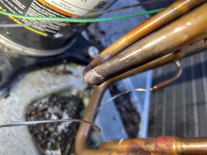 Responded to heat pump system displaying low pressure fault code and no cooling condition. Upon arrival, verified system was in fault mode and conducted diagnostic assessment of refrigerant circuit. Measured supply air temperature at 83°F, confirming inadequate cooling performance. Inspected refrigerant lines, connections, and system components for visible signs of refrigerant loss or mechanical failure. Documented current system conditions including copper line set and equipment configuration through photography. Per customer request, no refrigerant charging or repair work was performed during this diagnostic visit. System remains in non-operational status with low pressure fault active.