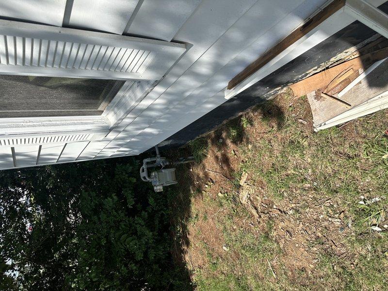 Completed comprehensive HVAC replacement estimate for 14-year-old system with indoor unit currently located in crawlspace. Customer requested evaluation for rerouting indoor unit to more accessible location during replacement, assessed existing ductwork configuration and structural requirements for potential relocation. Documented current equipment condition and installation environment through photographic documentation showing deteriorated crawlspace conditions and exterior access points to support replacement recommendations.