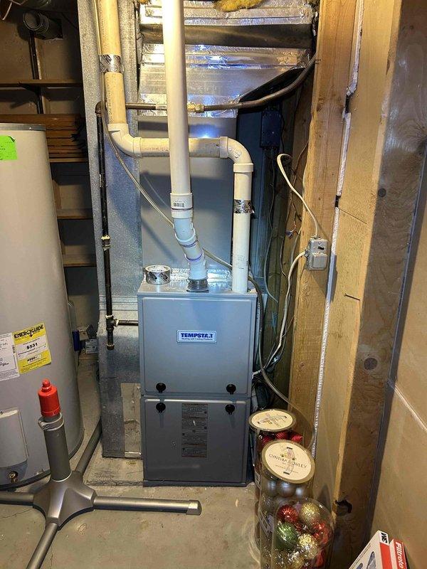 Responded to no cooling complaint on 14-year-old electric air conditioning system with Tempstar furnace located in basement. Coordinated access with housesitter while homeowner was on vacation. Performed diagnostic evaluation of outdoor condensing unit and indoor air handler to identify cause of cooling failure. Inspected compressor operation, refrigerant levels, electrical connections, capacitor function, and airflow components to determine necessary repairs for restoring cooling capacity to the system.