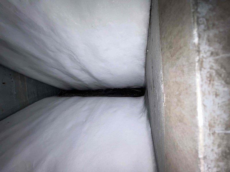 Responded to no cooling complaint on electric air conditioning system with indoor unit located in basement. Upon arrival, performed diagnostic evaluation of system blowing room temperature air. Inspected outdoor condensing unit and indoor air handler components. Identified issue preventing proper cooling operation. Completed necessary repairs to restore system functionality. System tested and verified operating within normal parameters with proper cooling output prior to departure.