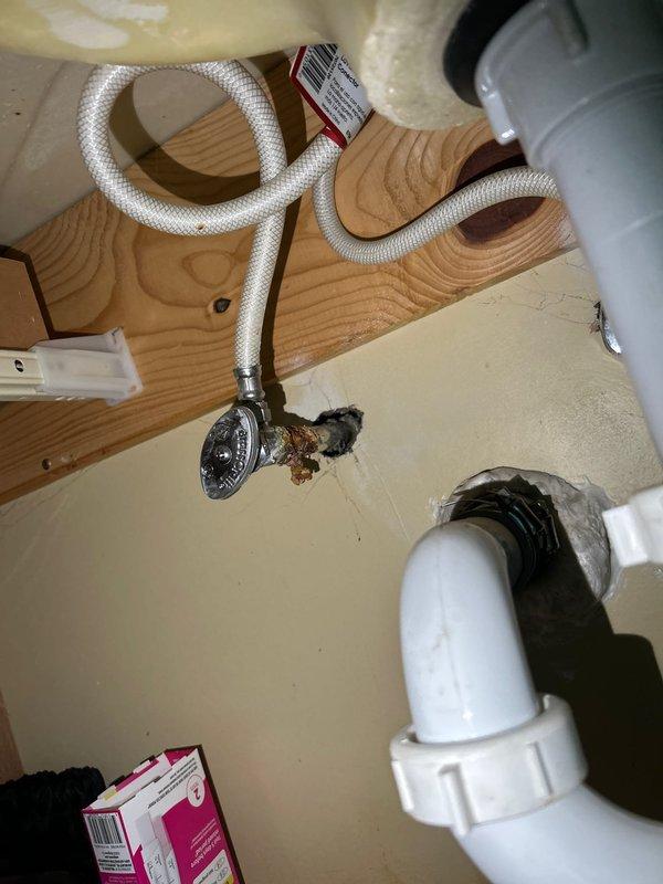 Performed routine maintenance on tanked water heater system, including complete flush to remove sediment buildup and ensure optimal performance. Inspected associated plumbing connections beneath sink, noting minor corrosion and mineral deposits on supply line fittings at shut-off valve connection points. All plumbing components, including PVC P-trap assembly, flexible braided supply lines, and drain connections, were examined and found to be in functional condition with no active leaks detected.