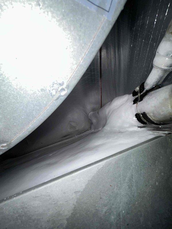 Responded to no cooling complaint at apartment complex unit. Upon arrival, performed diagnostic inspection of HVAC system including evaporator coil and rooftop condensing unit components. Inspected refrigerant lines, valve assembly, and internal air handling components. Documented equipment condition with photographs showing evaporator coil section and exterior refrigerant line connections with service valves. System evaluated for cooling capacity issues.