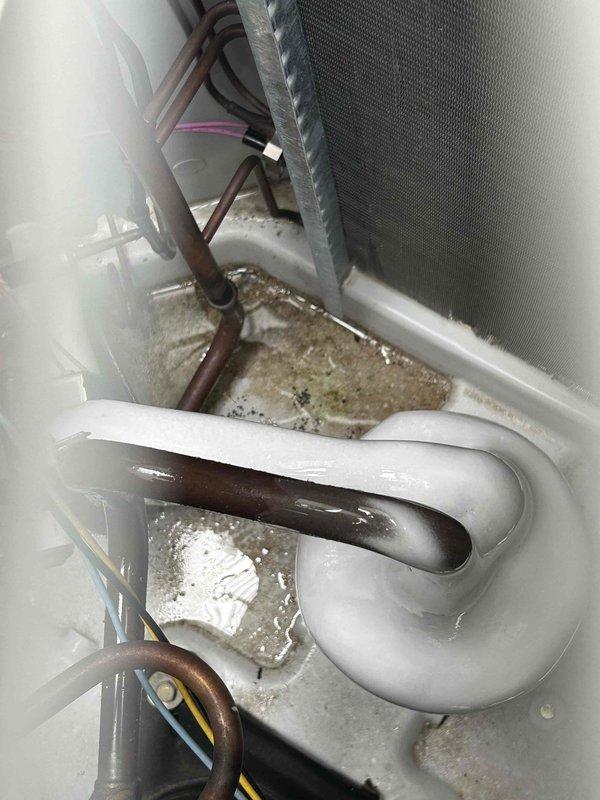Responded to no cooling complaint at apartment complex unit. Upon inspection, found evaporator coil completely frozen with heavy ice buildup throughout. Identified restricted airflow as root cause due to severely clogged air filter. Powered down system to allow coil to thaw properly. Removed and replaced dirty filter with new filter. Inspected blower motor operation and verified proper function. Once coil fully defrosted, restarted system and confirmed adequate airflow across evaporator. Monitored system operation through complete cooling cycle. Verified proper temperature split and confirmed unit now cooling effectively. System restored to normal operation.