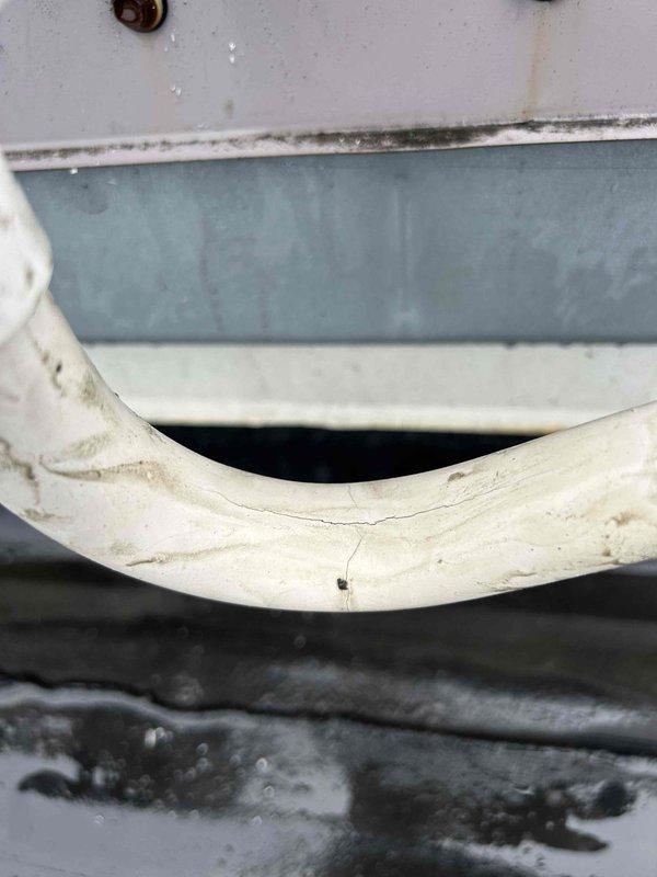 Responded to no cooling complaint on electric rooftop HVAC system blowing warm air and unable to maintain setpoint. Upon inspection, found indoor unit in utility closet with dirty evaporator coil and condensate drain pan showing significant debris accumulation and biological growth. Performed system diagnostics, cleaned evaporator coil, cleared condensate drain line, and verified proper airflow and refrigerant operation to restore cooling capacity.