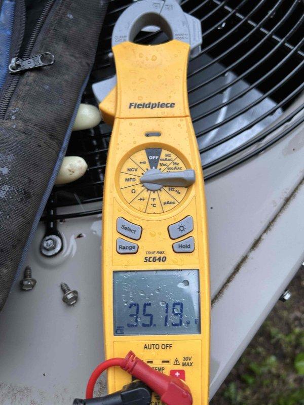 Completed comprehensive Gold Level preventive maintenance on dual HVAC systems in a two-system residential property. Serviced heat pump and air handler located on ground floor, along with air conditioning unit on ground floor and furnace installations in basement and attic accessed via pull-down ladder. Performed thorough system diagnostics using digital clamp meter and multimeter to verify electrical performance, amperage draws, and temperature readings on both systems. Inspected all major components including condensers, evaporator coils, blower assemblies, and ductwork. Verified proper refrigerant pressures and system operation. Customer-supplied filters in sizes 16x25x1 and 12x20x1 were noted for system maintenance. Conducted voltage and amperage measurements on outdoor condensing units, recording readings of approximately 35.78 on primary system. Tested temperature differentials across coils and confirmed proper system cycling. Inspected all electrical connections, contactors, and