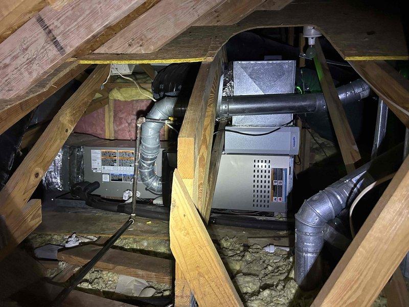 Completed semiannual maintenance inspection on a one-year-old air conditioning system located in the attic space above the garage. Accessed equipment via pull-down attic ladder and performed comprehensive tune-up including inspection of the AC unit and air handler, verification of refrigerant levels, electrical connections, and ductwork integrity. System operating within normal parameters with no deficiencies noted; Aprilaire #410 filter inspected and found in acceptable condition requiring no replacement at this time.