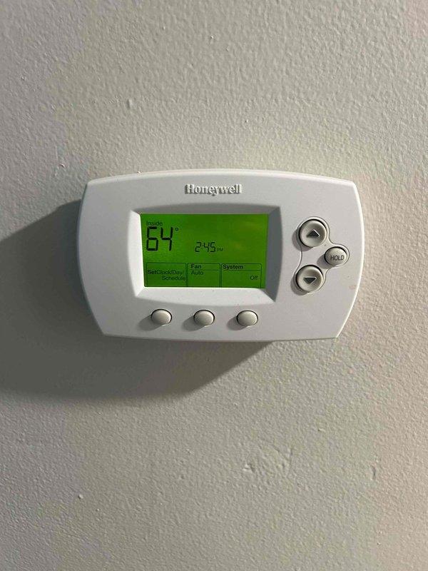 Completed Care Plan tune-up on gas furnace, air conditioning system, and evaporator coil located in basement. Performed comprehensive maintenance inspection and system evaluation. Verified proper operation of REME-HALO air purification device integrated within ductwork system, confirmed blue LED indicator illuminated and unit functioning correctly. Checked Honeywell digital thermostat operation, display reading 64°F at time of service with all controls responding appropriately. Noted system utilizes 16" x 25" x 1" air filter size, filter not included with service. All equipment operating within normal parameters upon completion of maintenance procedures.