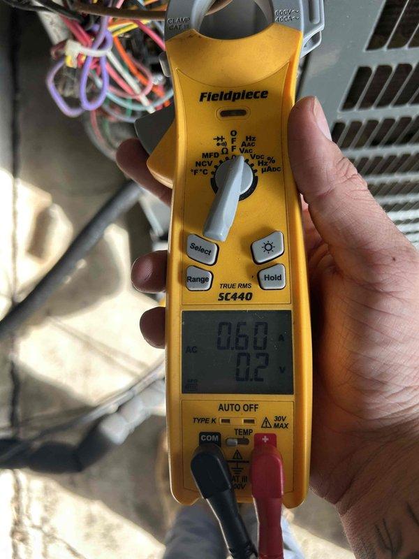 Responded to a no cooling call on a 10-year-old electric air conditioning system with indoor unit located in garage. Customer reported system blowing warm air with thermostat set to 77°F but indoor temperature reading 83°F. Upon arrival, performed complete system diagnostics using refrigerant manifold gauges and electrical testing equipment. Measured system pressures showing suction side at 107.2 PSIG and discharge side at 284.5 PSIG, indicating abnormal refrigerant pressures. Conducted electrical testing on system components to verify proper voltage and amperage readings. Identified cooling deficiency and documented system performance with diagnostic equipment readings for repair recommendations.