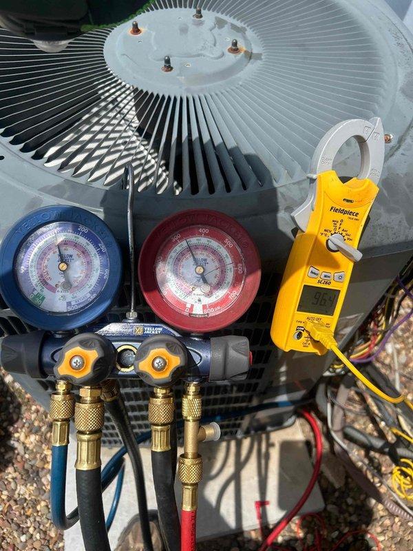 Responded to non-urgent service call for insufficient cooling on 12-year-old air conditioning system. Upon arrival, confirmed unit was operational but not meeting desired temperature setpoint. Connected manifold gauge set to service ports and recorded refrigerant pressures on both high and low sides. Utilized digital clamp meter to measure compressor amperage draw, which registered within acceptable range at 9.0-9.8 amps. Performed comprehensive system diagnostics including visual inspection of condenser fan assembly, verification of proper fan motor operation, and assessment of overall condenser unit condition. Based on pressure readings and electrical measurements, determined system refrigerant charge and compressor performance were adequate. Completed full system evaluation and provided findings to customer regarding 12-year-old equipment performance characteristics.