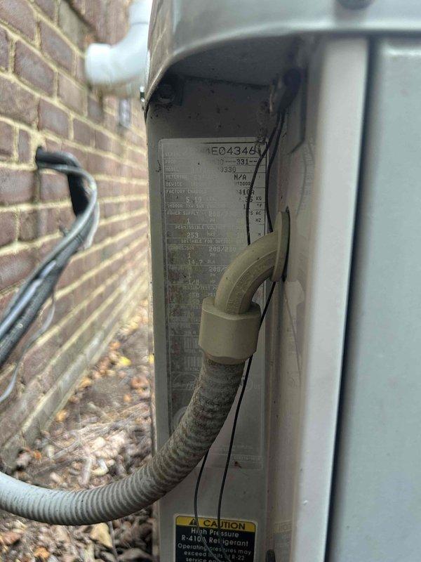 Responded to report of icing on furnace component while both heating and cooling systems remained operational. Upon arrival, performed comprehensive system inspection of outdoor condensing unit and refrigerant circuit. Utilized calibrated refrigerant scale to verify system charge levels and diagnose potential causes of ice formation. Inspected condenser unit exterior components, refrigerant lines, and electrical connections. Assessed R-410A refrigerant specifications and system performance parameters. Documented equipment condition with photographic evidence showing outdoor unit installation, refrigerant line routing, and measurement equipment readings. Systems found operating within normal parameters at time of inspection with no active icing present on accessible components.